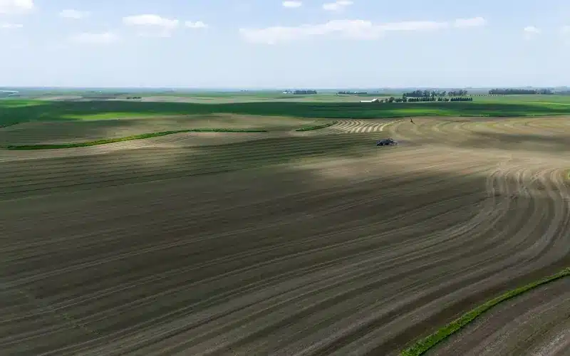 Agricultural teams and machinery working during the harvest season