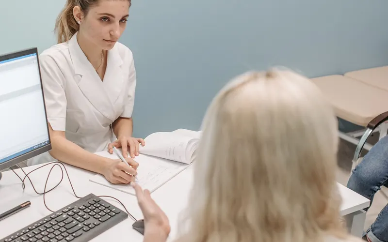 Medical professionals discussing a planned change in a clinic office