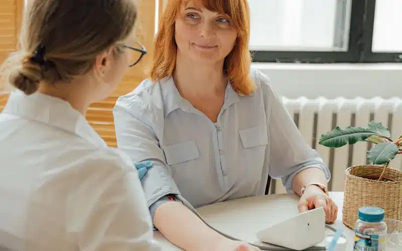Doctor and patient reviewing a care plan during a clinic consultation